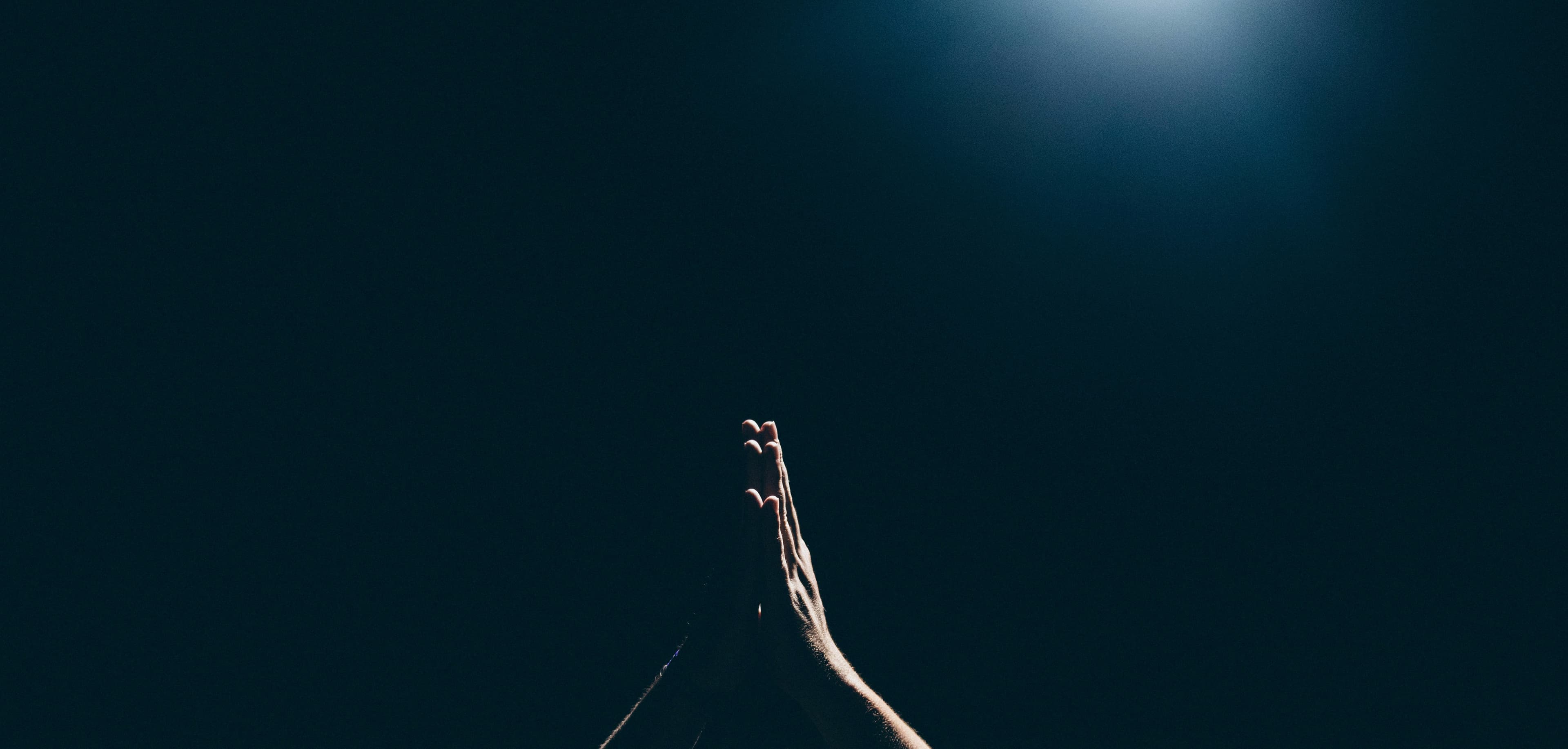 Hands raised in prayer